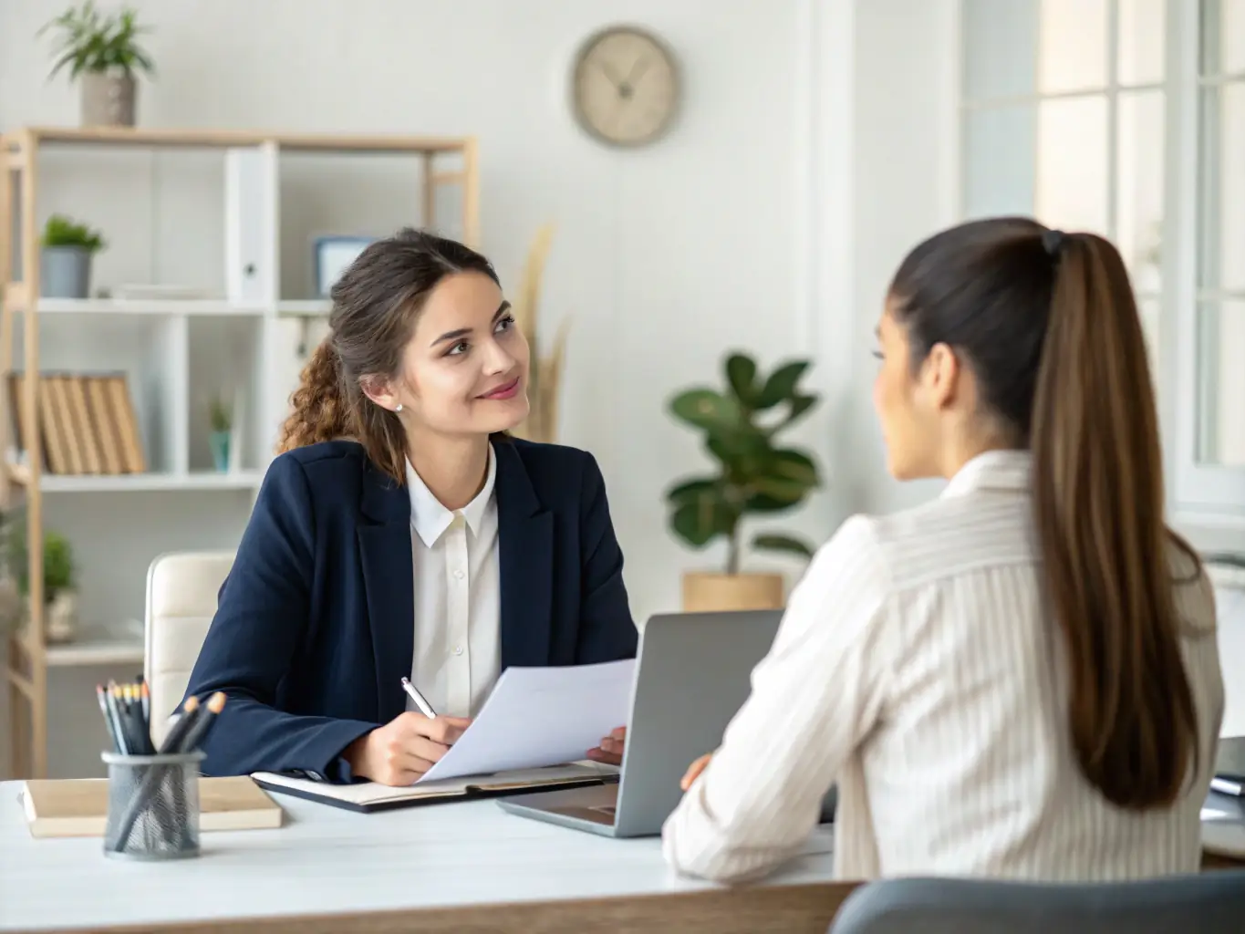 A young professional in a modern office setting, confidently participating in a job interview, showcasing ECP Consulting's recruitment services.